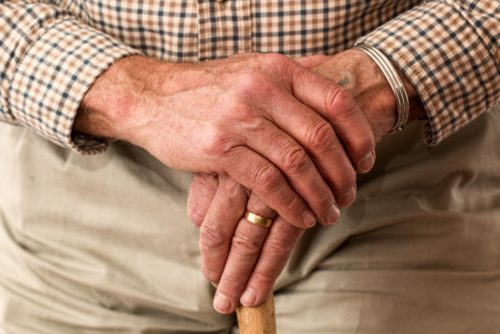 elderly person with wedding ring