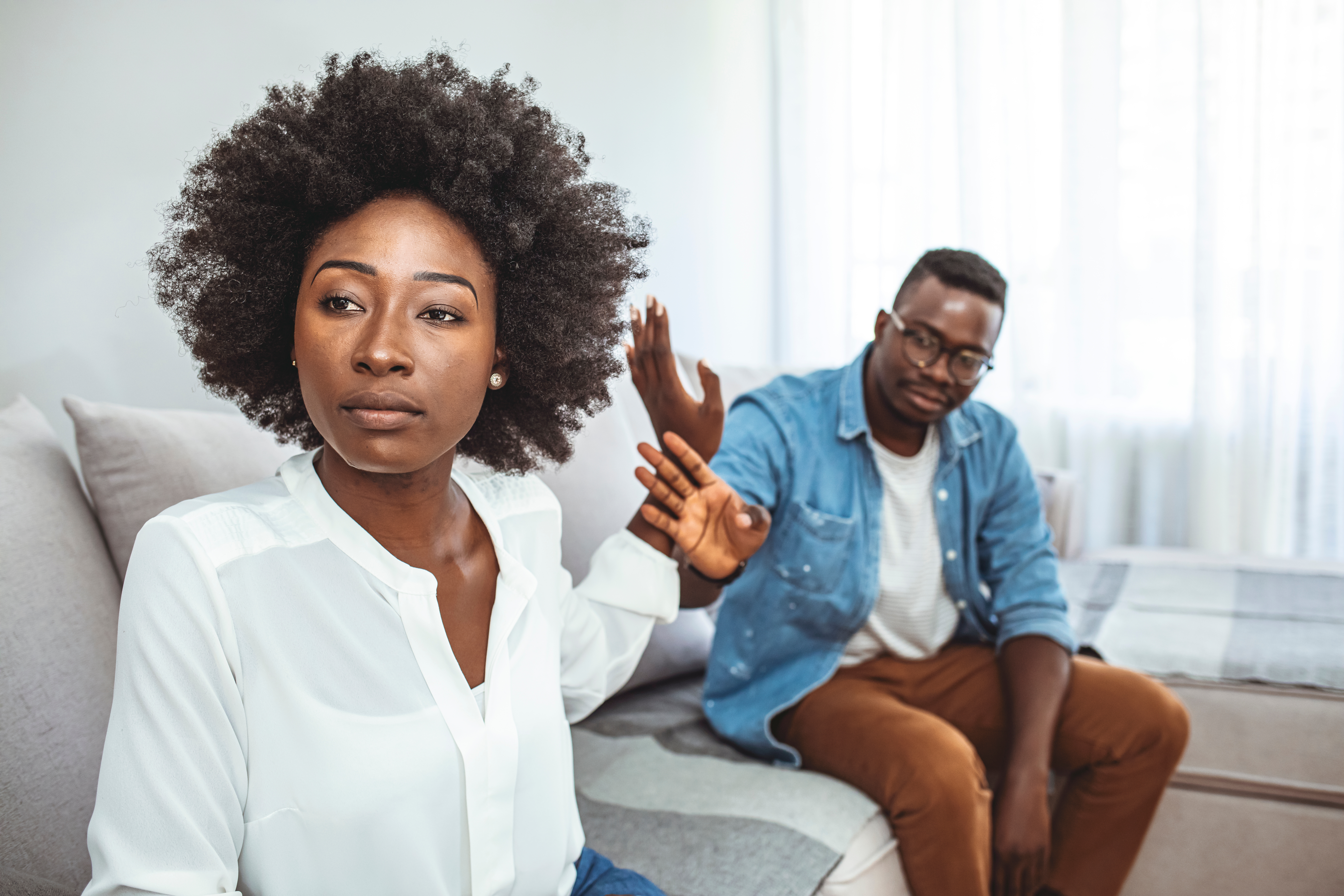 couple arguing on couch