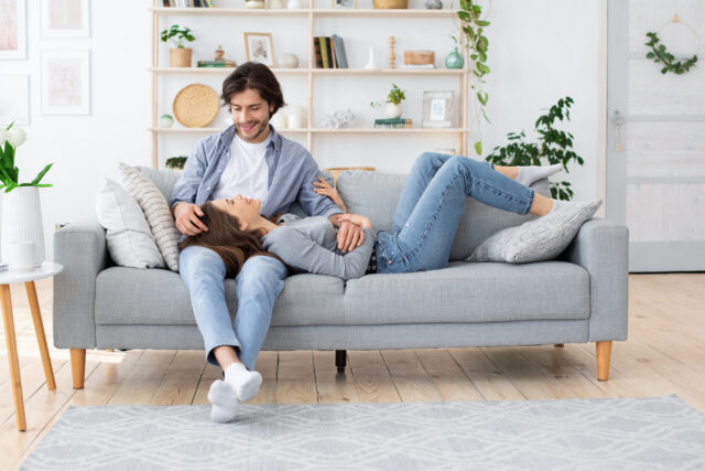 Man and woman in love spending time together at home