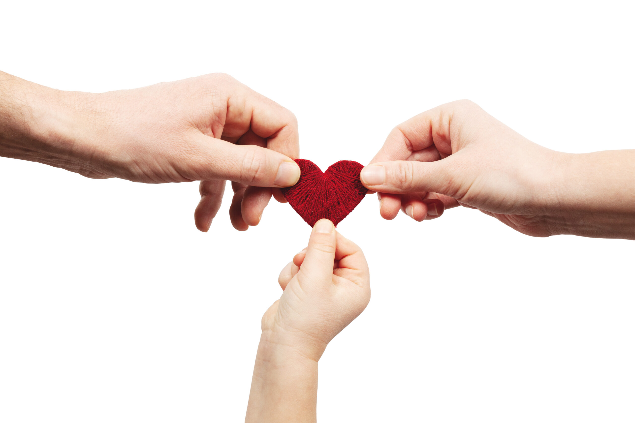 Hands of mom dad and baby hold the heart. Adoption of a child into a family. Love in foster.